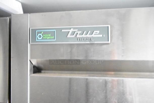True commercial freezer with "natural refrigerant" label, featured in Southern Dimensions 24' cold food trailer.