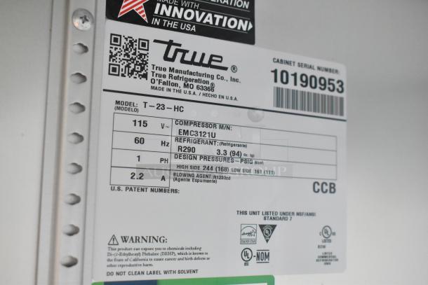 Label on True refrigeration unit in Southern Dimensions trailer, model T-23-HC, shows specifications and compliance markings.