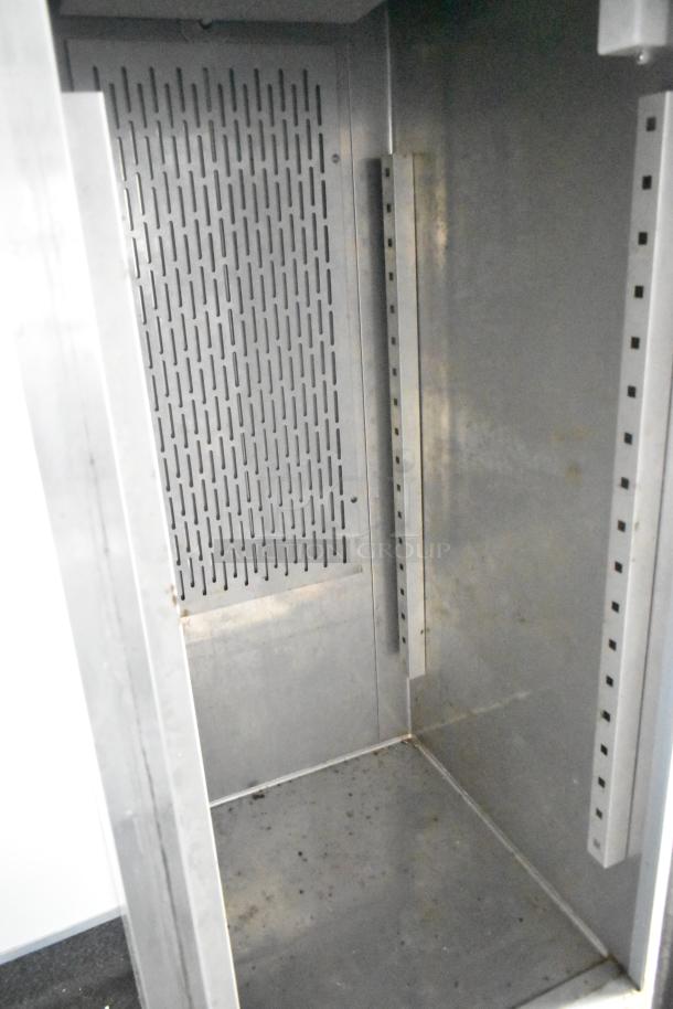 Interior view of Southern Dimensions 24' cold food trailer, featuring a metal shelving unit.