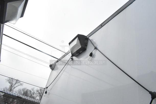 Exterior of a Southern Dimensions 24' cold food and beverage trailer with exterior lights.