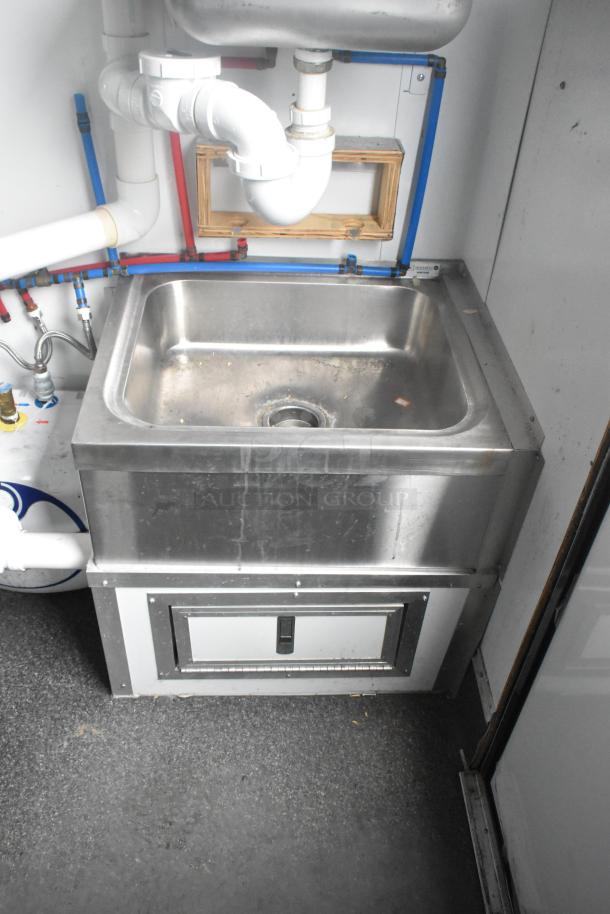 Southern Dimensions 24' trailer interior with stainless steel sink and plumbing, featuring durable commercial setup.