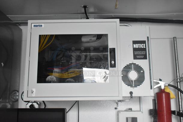 Electrical panel inside Southern Dimensions 24' trailer, featuring wires and a notice label for security recording devices.