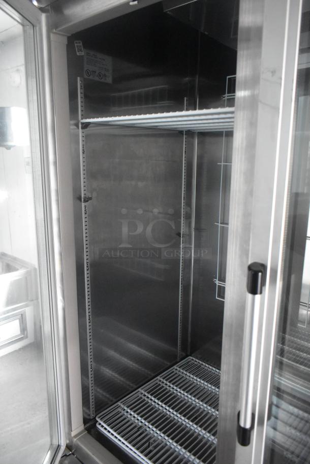 Southern Dimensions 24' cold food trailer interior featuring Norlake two-door cooler, wire shelving, and stainless steel finish.