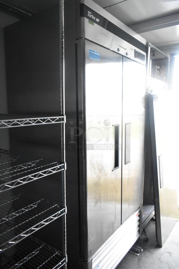 Southern Dimensions 24' trailer with Turbo Air 2-door freezer and wire shelving. Fully equipped for retail and food service.