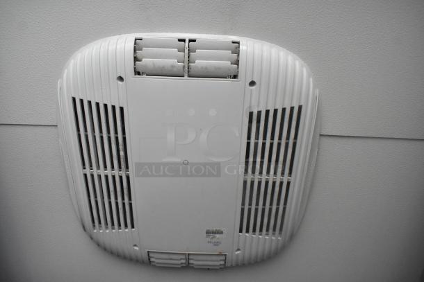 Interior ceiling vent of a Southern Dimensions cold food and beverage trailer, featuring ventilation grilles and a central panel.