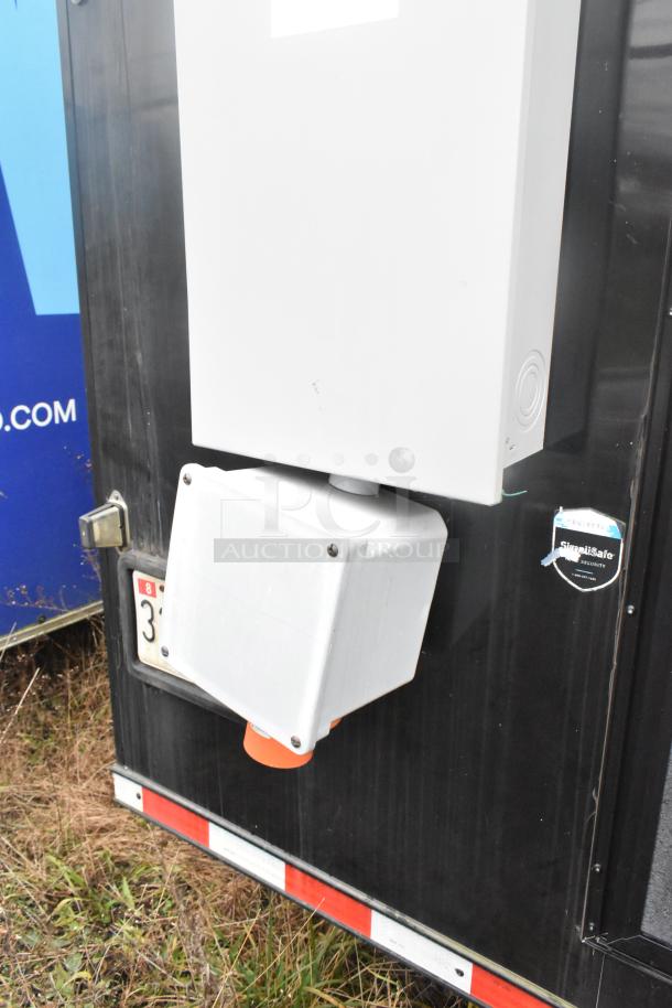 Southern Dimensions 24' trailer with utility connection, black exterior, security sticker. Ideal for cold food/beverage setup.