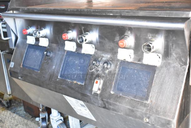 Control panel of a 28' Wendy's mobile kitchen trailer featuring operational switches and screens for commercial equipment.