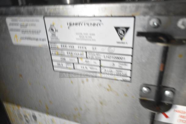 Label on Henny Penny fryer in Wendy's mobile kitchen trailer showing model and specs. Clear title included.