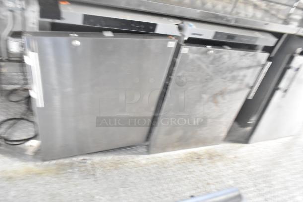 Stainless steel commercial coolers inside Wendy's fast food trailer, featuring Liebherr branding, ready for use.