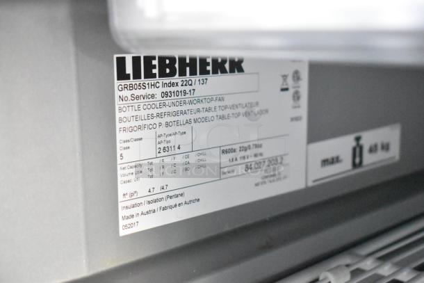 Label on Liebherr bottle cooler showing model GRB05S1HC, with specifications and manufacturing details. Made in Austria.