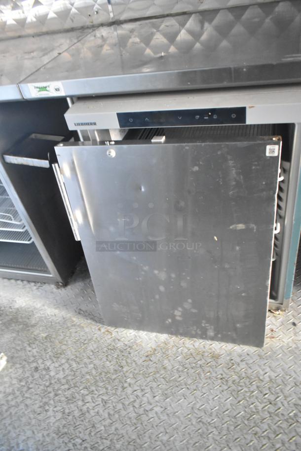 28' Wendy's fast food trailer interior featuring a Liebherr cooler. Stainless steel surfaces.