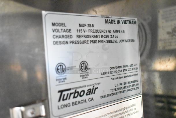 Label on Turbo Air refrigeration unit showing model MUF-28-N, voltage, frequency, refrigerant details, and compliance certifications.