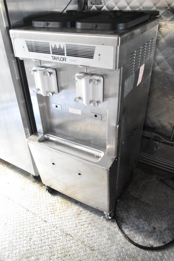 Taylor milkshake machine in a fast food trailer, commercial-grade, stainless steel, dual dispensers, tested and working.