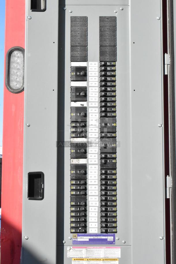 Electrical panel inside a 28' Wendy's fast food trailer, showing multiple circuit breakers labeled with numbers.