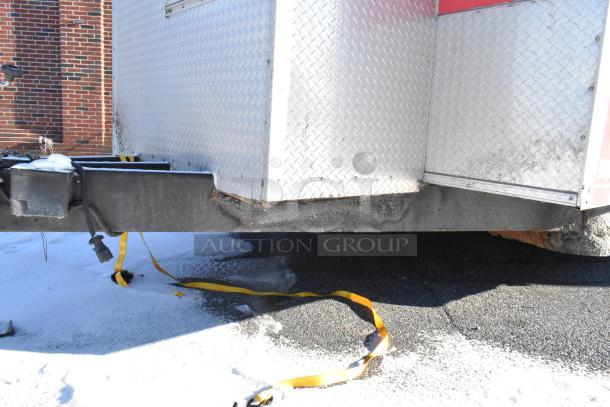 28' Wendy's fast food trailer in good condition. Diamond plate exterior, sturdy hitch, and safety straps visible.