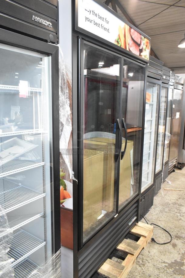 Brand new True TVM-48SL-HC 2-door reach-in cooler, commercial grade, 115V, scratch and dent, glass doors, shelving included.