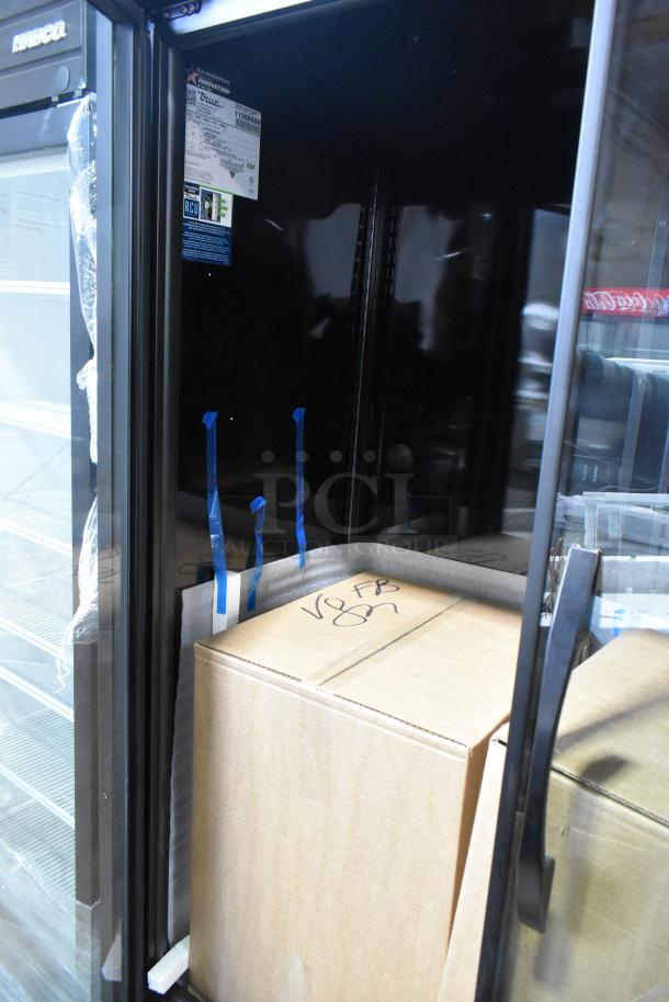 2025 True TVM-48SL-HC commercial cooler, 2-door, new scratch and dent, 115V, 1 phase, interior with packaging visible.