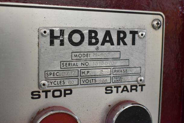 Hobart M-802 commercial dough mixer label with model, serial number, 208V, 3 phase, 2 HP specs, and start/stop buttons.