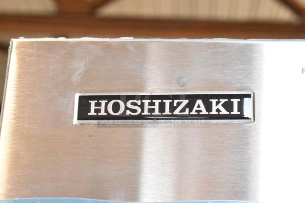 Brand new Hoshizaki KMS-1402MLJ ice machine head, stainless steel, 115-120V, 1 phase, visible brand logo.