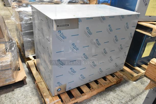 Brand new 2026 Hoshizaki KM-2200SWJ3 commercial ice machine, in packaging, 2221 lb/24 hr capacity, 208-230V, 3-phase.