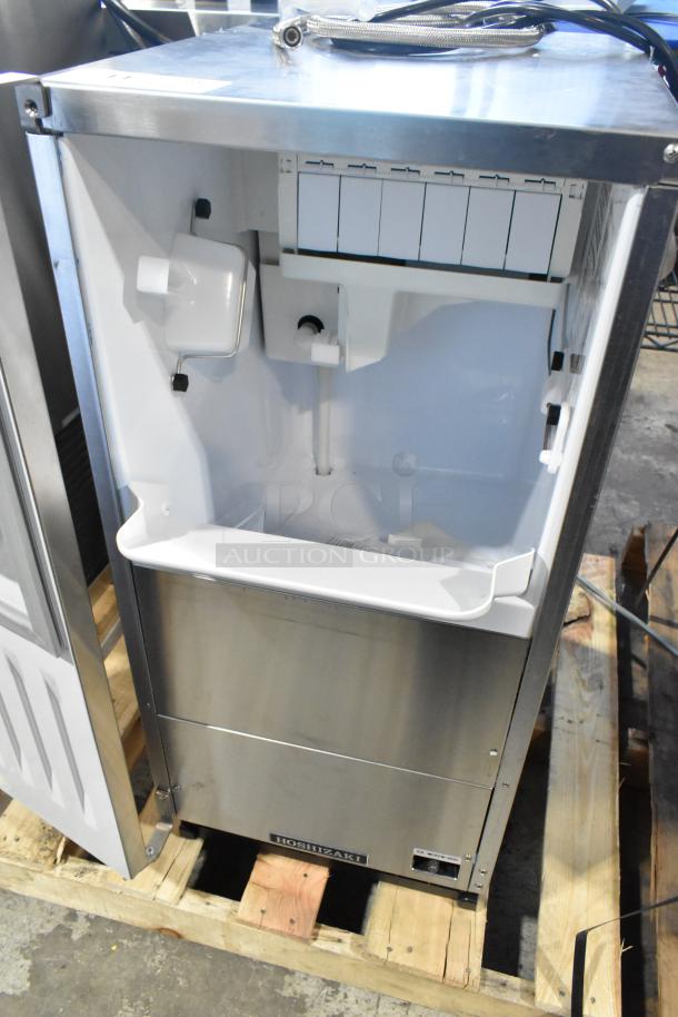 Brand new Hoshizaki AM-50BAK-DS ice machine, 54 lbs/day, 115V, 1 phase, stainless steel, interior view.