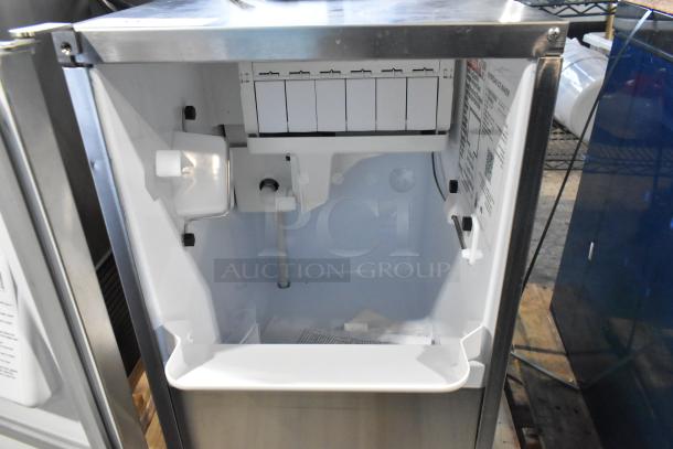 Brand new Hoshizaki AM-50BAK-DS ice machine. 115V, 1 phase. Undercounter design. Capacity: 54 lbs/day. Tags detail specs.