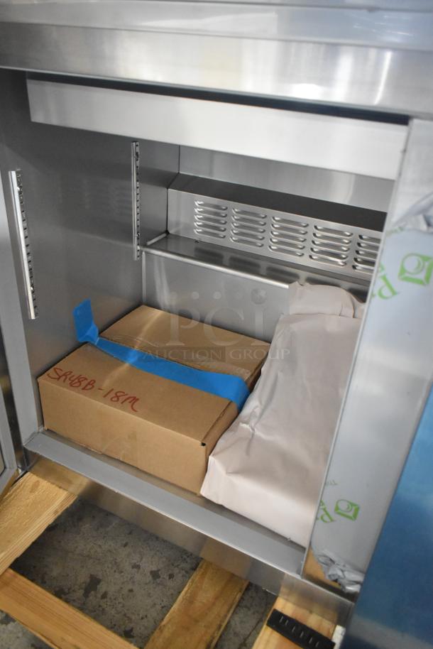 Brand new Hoshizaki SR48B-18M sandwich salad prep table interior. Includes box labeled "SR48B-18M." Stainless steel finish.