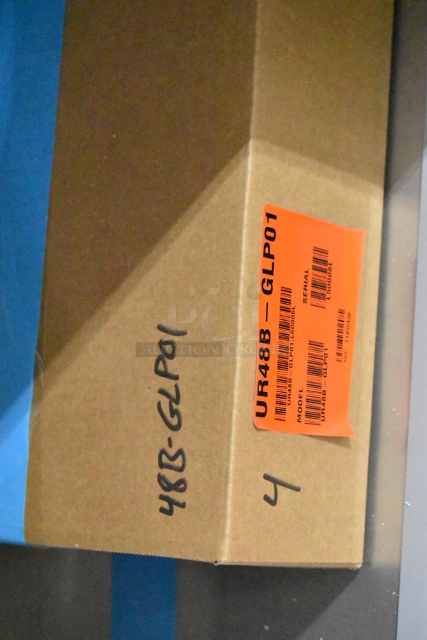Cardboard box of Hoshizaki UR48B-GLP01 cooler with orange label showing model and serial numbers. Brand new condition.