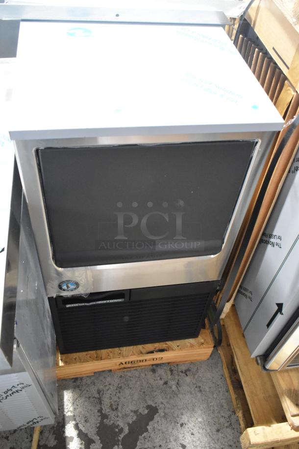 Brand new 2026 Hoshizaki commercial self-contained ice machine, stainless steel, packaged on wooden pallet, excellent condition.