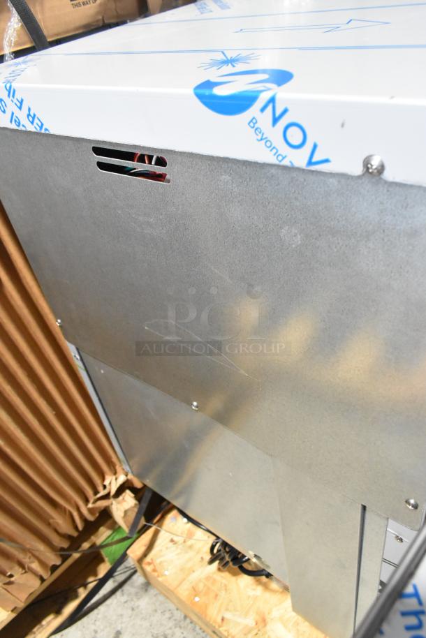 Brand new 2026 Hoshizaki Commercial Self Contained Ice Machine. Visible sleek metal panel, pristine condition, original packaging.