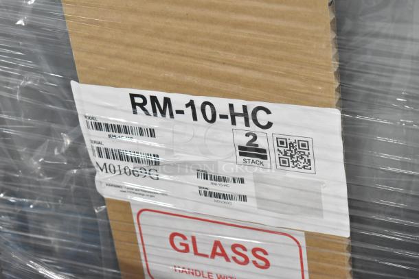 Brand new Hoshizaki RM-10-HC cooler in packaging, model RM-10-HC label visible, indicating single door, 115 volts, 1 phase.