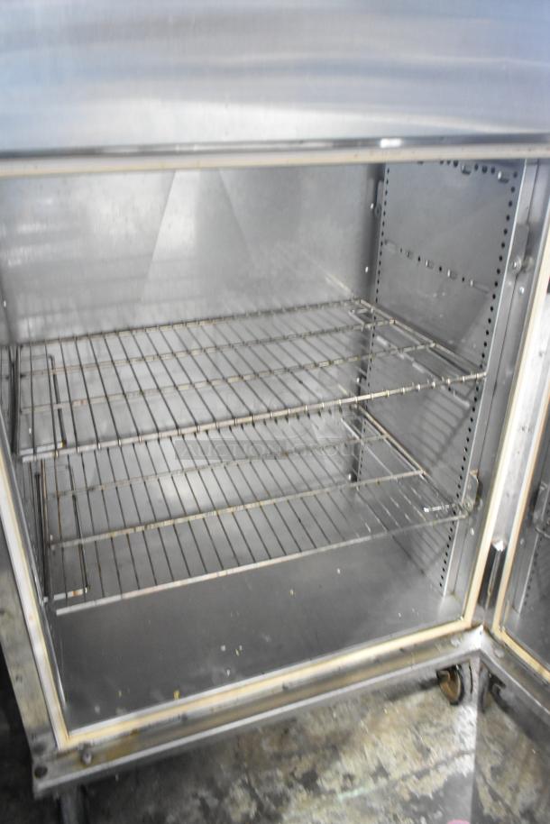 Bevles CS82 heated holding proofing cabinet, stainless steel, commercial casters, 120V, 1-phase, clean interior, used condition.