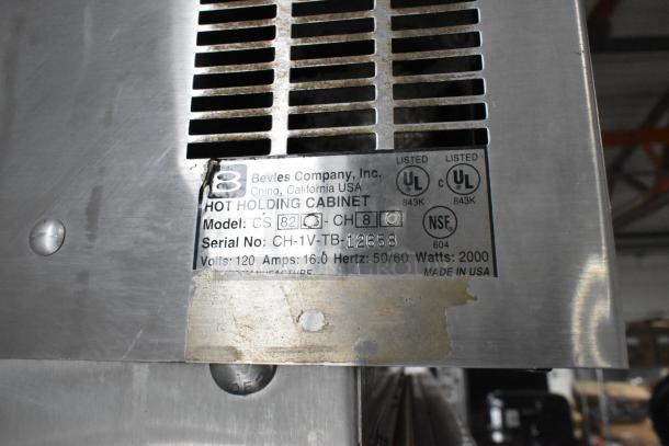 Bevles CS82 heated holding cabinet, UL listed, 120 volts, made in USA. Model tag visible with specs and serial number.