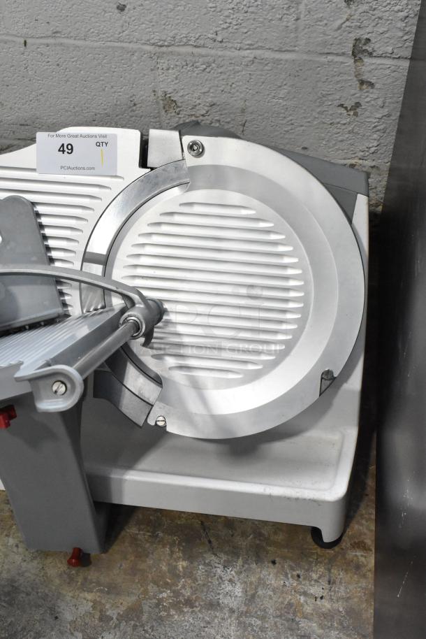 Berkel X13A commercial meat slicer, 120V, 1 phase, in good condition, with visible auction tag number 49.