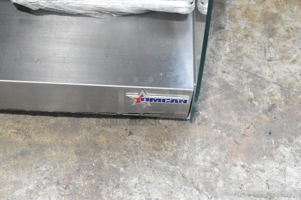 Omcan Countertop Heated Display, stainless steel, 2 tiers, visible logo, used condition, ideal for food warming.