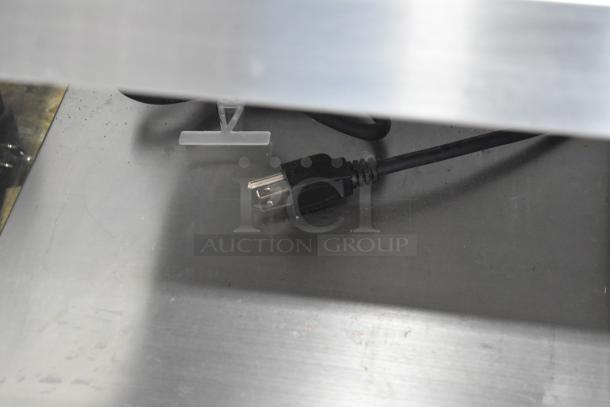 Omcan countertop heated 2-tier warming display, stainless steel, power cord shown, ideal for food service, good condition.