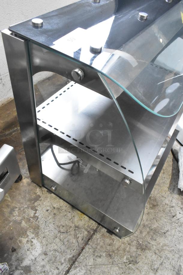 Omcan countertop heated 2-tier warming display with glass shelves; stainless steel frame; power cord included; good condition.