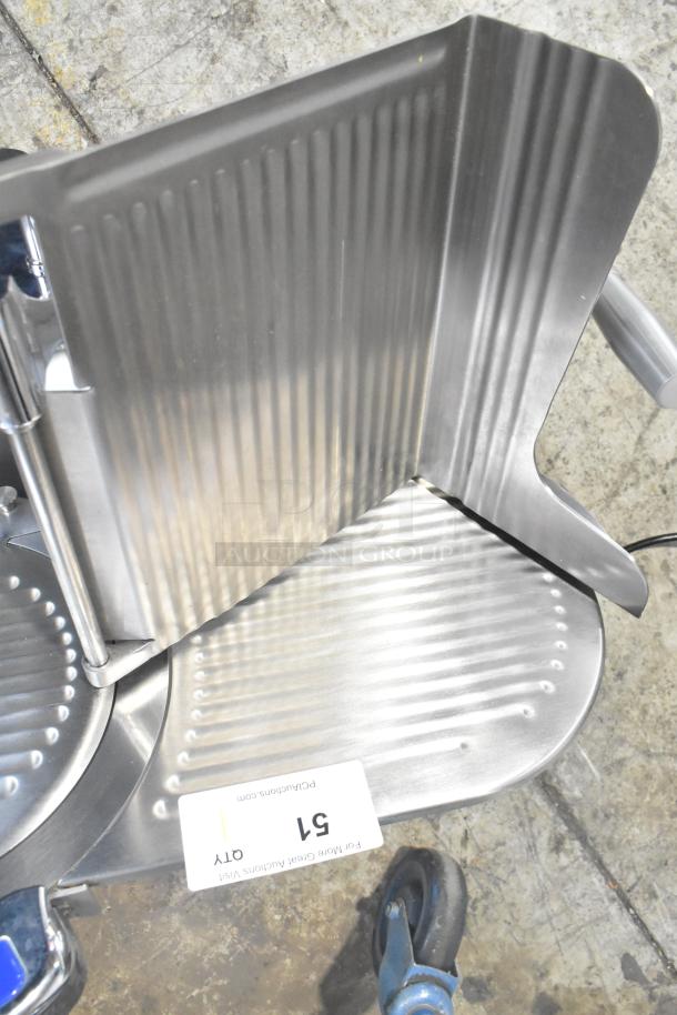 Globe Chefmate GC512 meat slicer with blade sharpener, 115V 1 Phase, stainless steel, good condition, model visible.