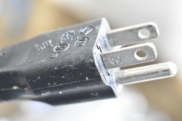Close-up of a three-prong plug attached to the Globe Chefmate GC512 Commercial Meat Slicer. 115V, 1 Phase.