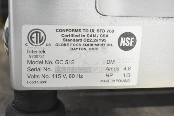 Globe Chefmate GC512 meat slicer label showing model, voltage, and certifications. 115V, 1 phase, made in Poland.
