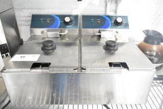 Brand new 2023 Hoocoo FRY-20L stainless steel dual deep fat fryer, 120V, with 2 metal baskets and lids.