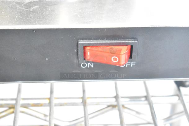 Avantco 177W52 countertop coffee pot warmer switch, showing a red on/off toggle switch, mounted on a wire rack.
