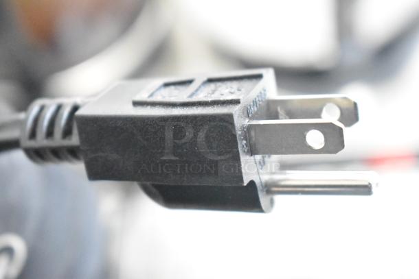 Close-up of a black power plug for the Avantco 177W52 coffee pot warmer, showing prongs and cord detail.