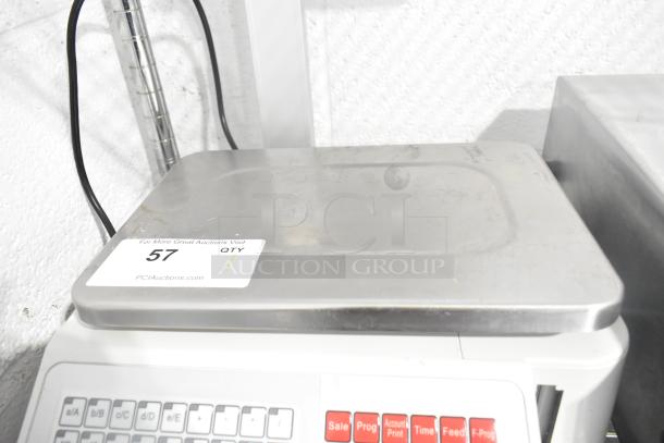 Detecto DL1030P 30lb digital price computing scale with label printer and pole display, showing label "57 QTY PCIAuctions.com."