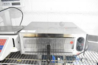 Carnival King 382CPO12TS stainless steel countertop pizza oven, adjustable thermostat, 120V, used condition with visible markings.