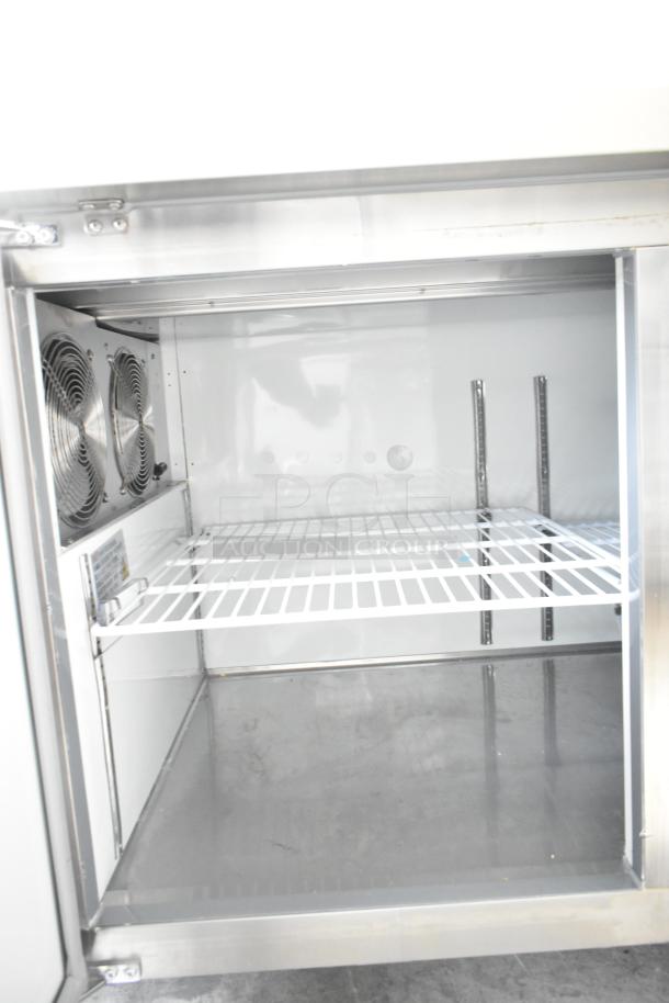 2024 Avantco 178APPT91HC Commercial Pizza Prep Table, stainless steel, on casters, interior view, 115V, 1 phase.