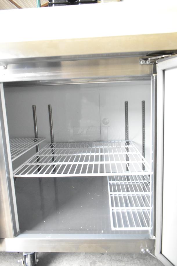 2024 Avantco 178APPT91HC commercial pizza prep table with adjustable wire shelves, stainless steel finish, commercial casters.