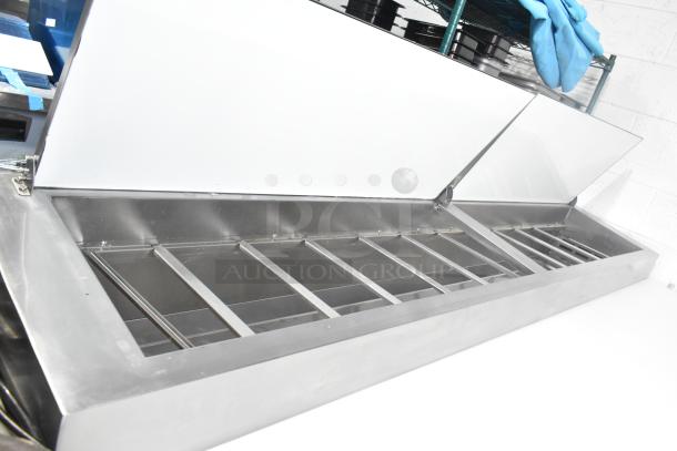 2024 Avantco 178APPT91HC commercial pizza prep table with dual lids, stainless steel, on casters, 115V, 1 phase.