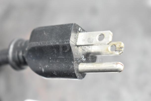 Close-up of Krampouz CEBIR4BS crepe maker power plug, showing standard 3-prong 120V connection.