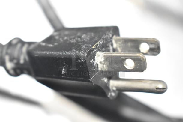 Close-up of a standard three-prong electrical plug for the Krampouz CEBIR4BS 16" Electric Crepe Maker, 120 Volts.